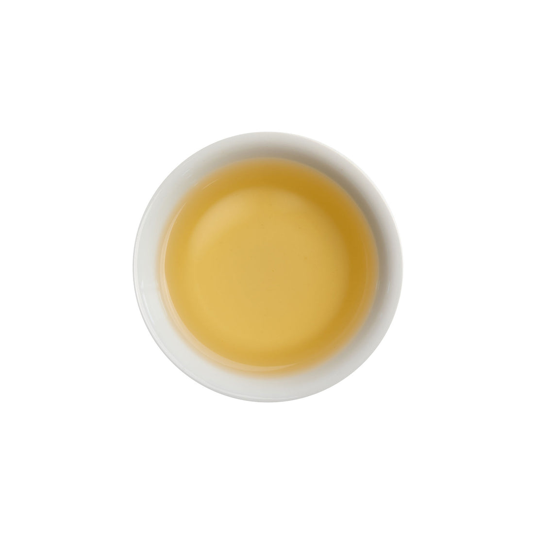 Ein ansprechendes Foto von unserem aufgebrühten Grünen Tee Curly Green in einer Tasse.
