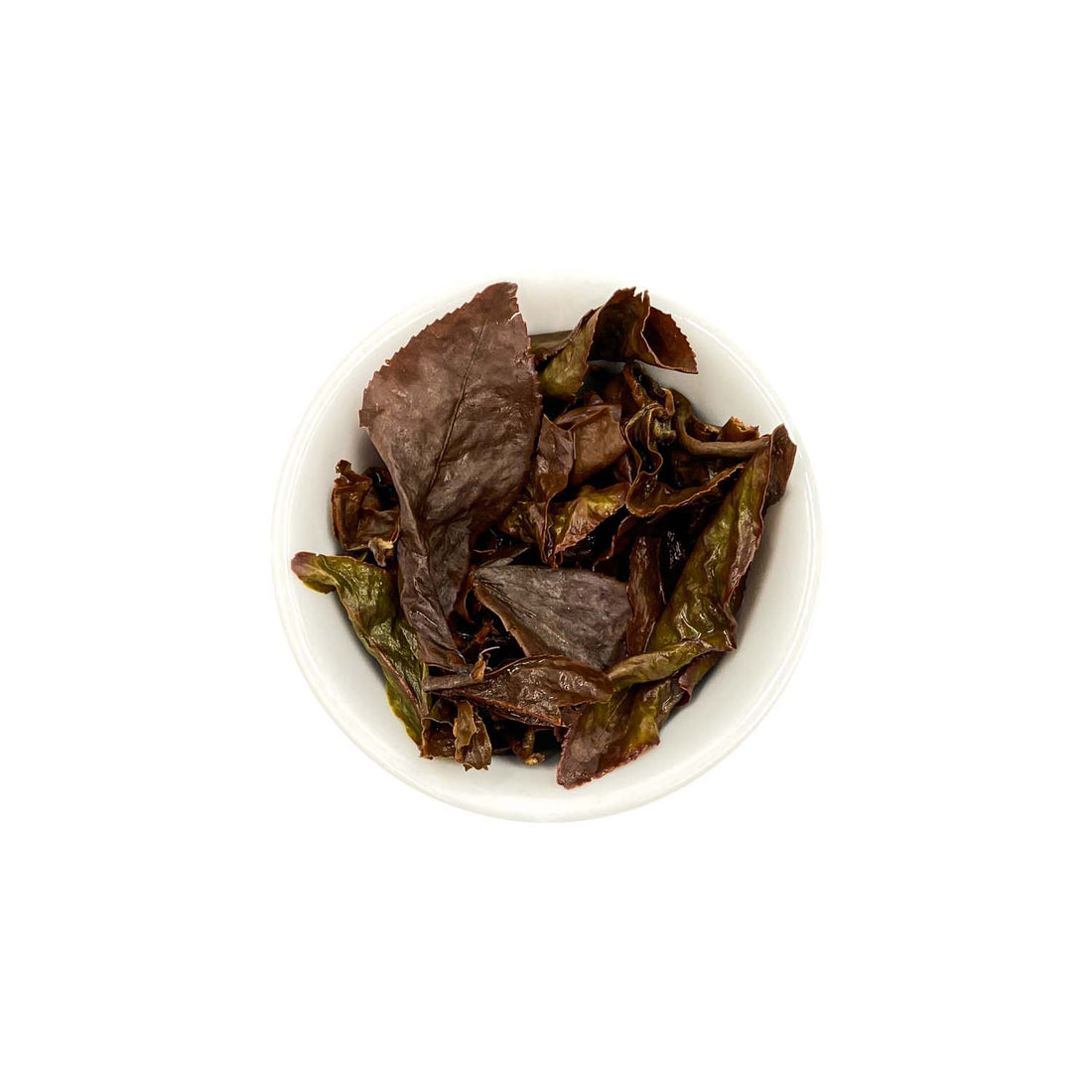 Ein ansprechendes Foto von den losen, aufgebrühten Blättern unseres GABA Oolong Tees Golden Sky in einer Tasse.